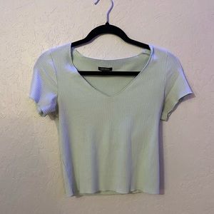 This shirt is so cute! Very pretty shade of green!